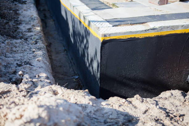 Professional Waterproofing technician working in Trafalgar, IN